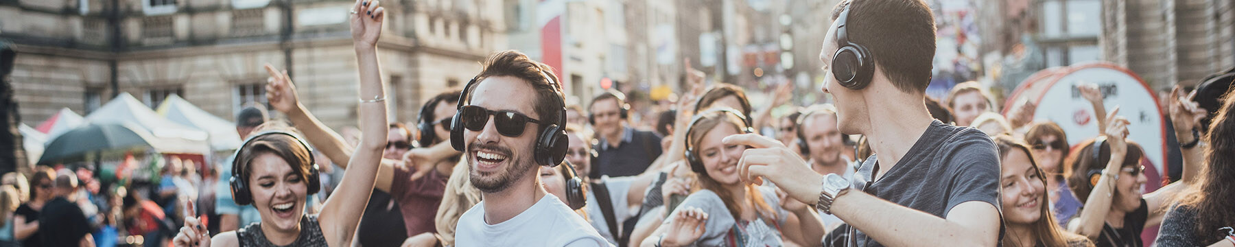 Image of Fringe goers at a silent disco on the Royal Mile.